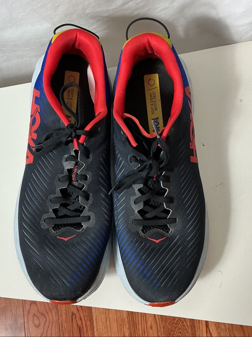 Hoka Men’s Rincon 3 Black Running Shoes with Red and Blue Accents